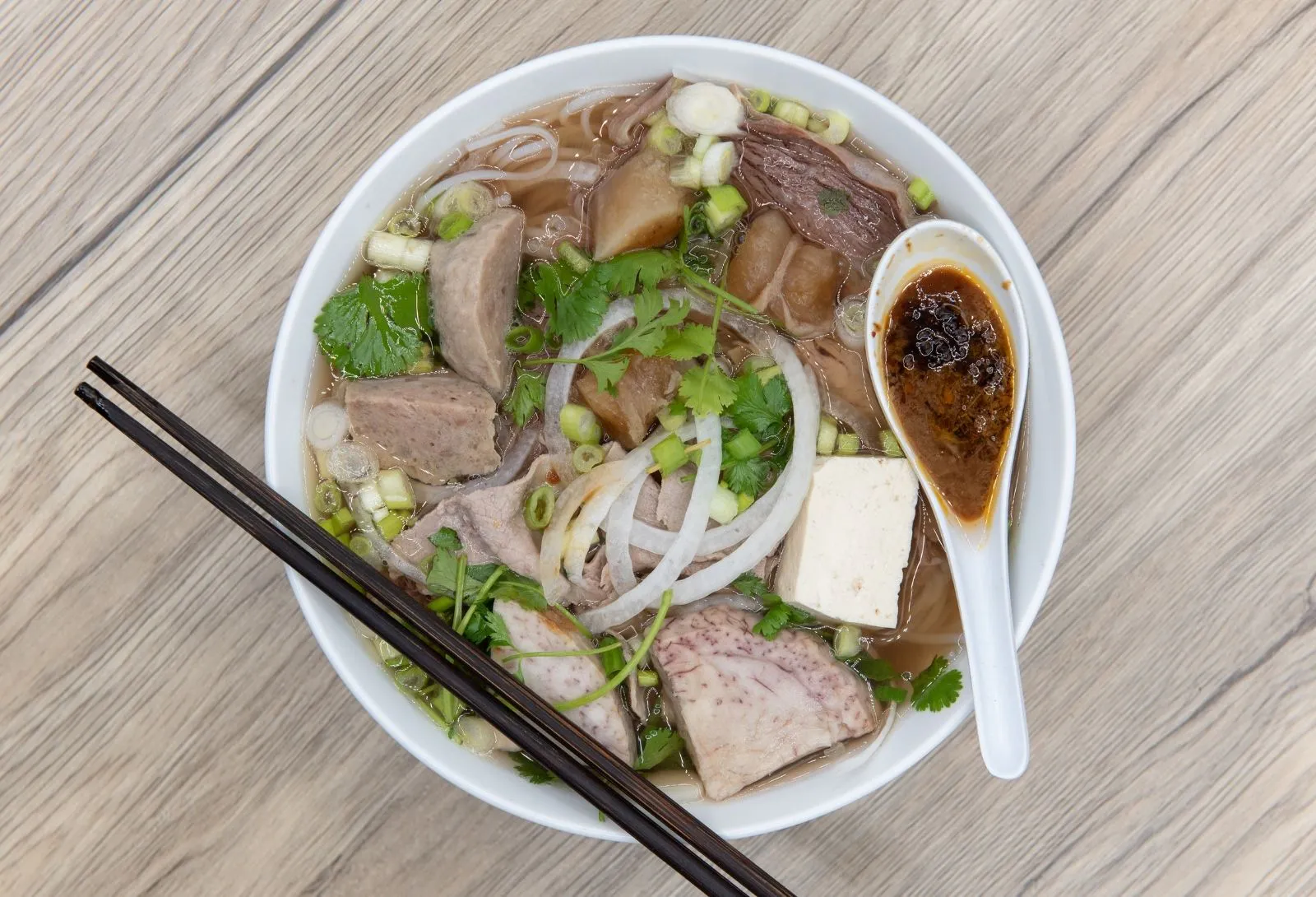 Beef brisket pho with meatballs, tendon and herbs at Miss Saigon, a Vietnamese Restaurant in Centreville